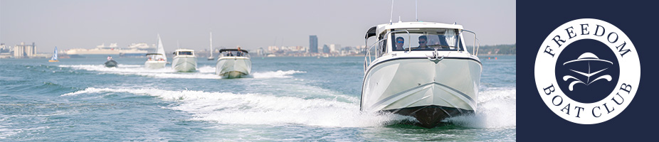 Four boats trailing each other